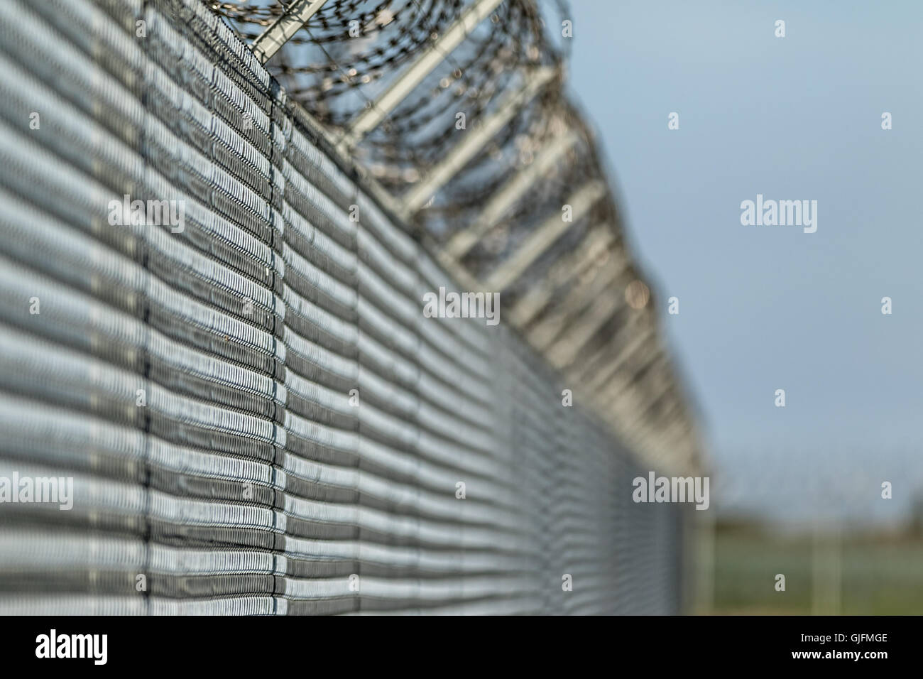 Barbwire fence against illegal immigration concept picture Stock Photo