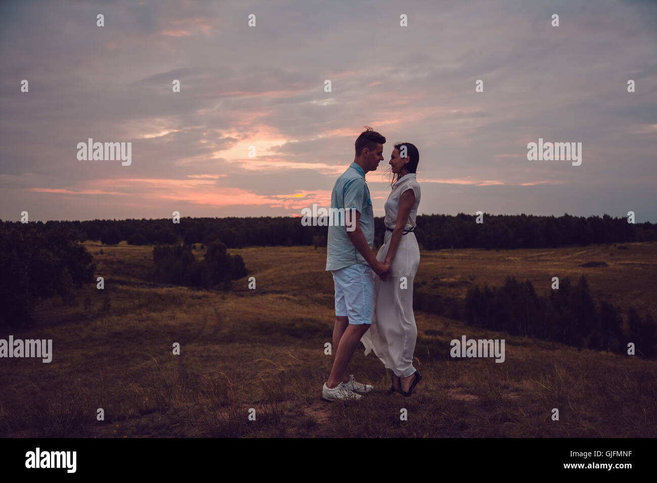 Love story. In love couple walking on sunset background. Silhouette ...
