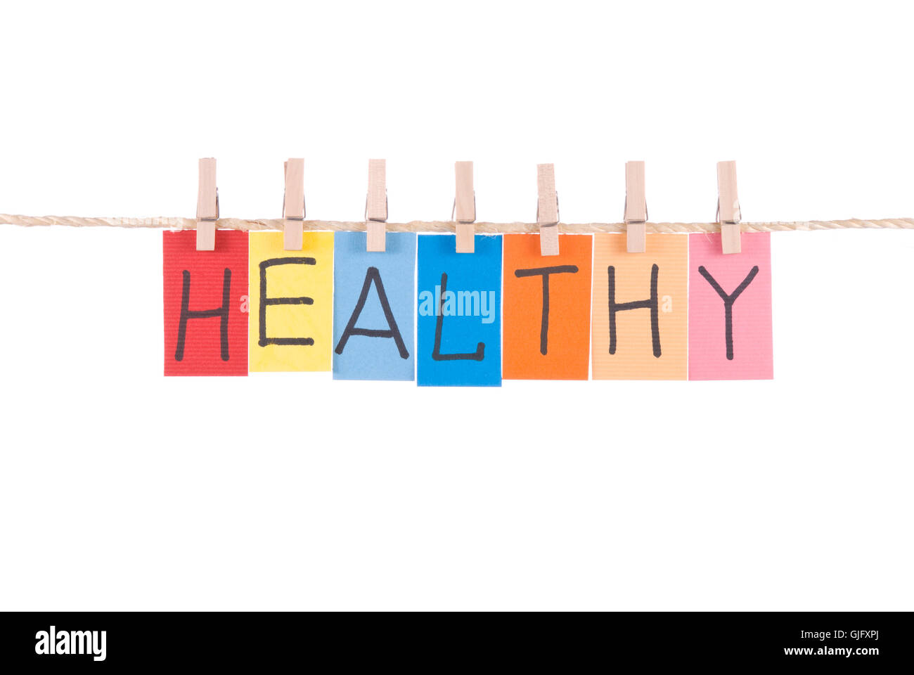 Healthy, words hang by wooden peg Stock Photo Alamy