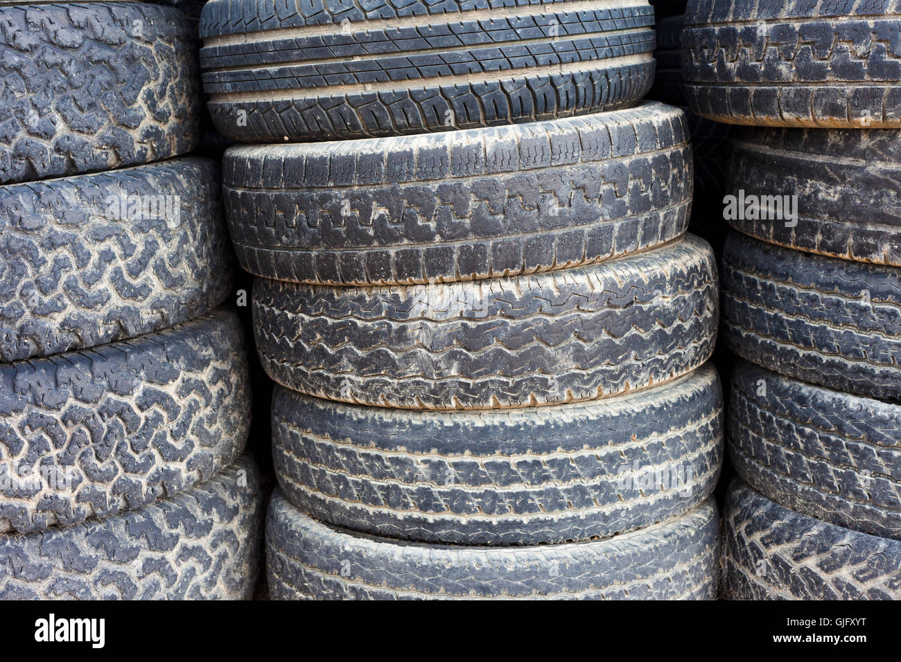 Stacked old tires background Stock Photo - Alamy