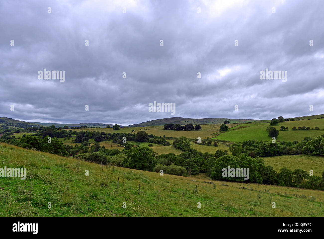 The rolling hills of the Pennines, near Chapel-en-le-Frith in Derbyshire, under a grey coudy sky Stock Photo