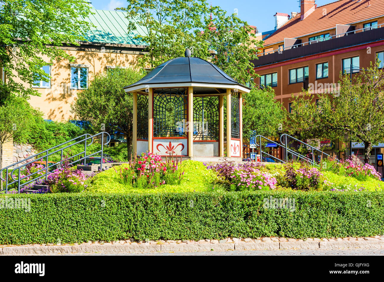 Kalmar, Sweden - August 10, 2016: Lovely octagonal gazebo on an elevated position and with two stairs leading up to it in a publ Stock Photo