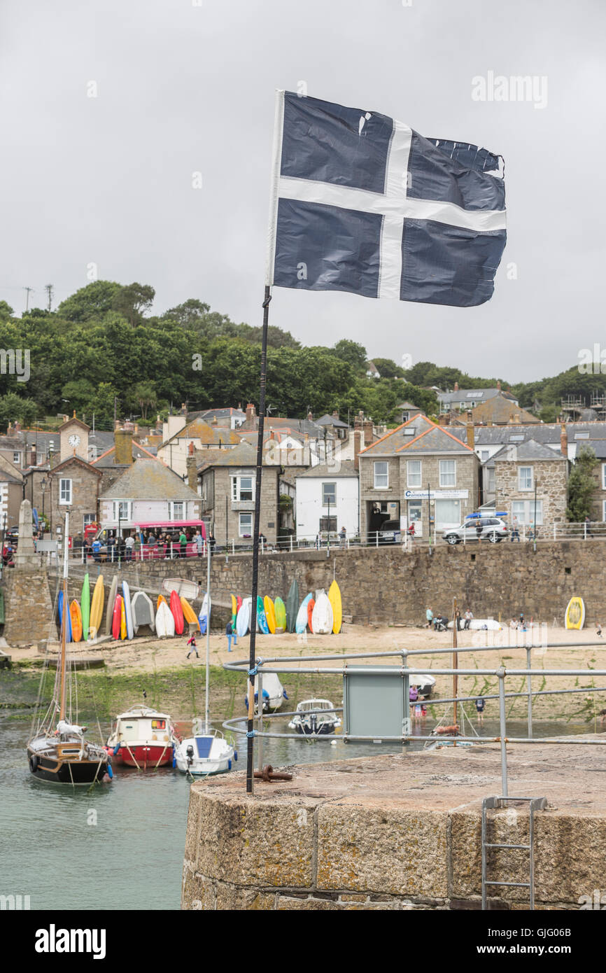Flag of Cornwall in the port of Mousehole, Cornwall, UK. Stock Photo