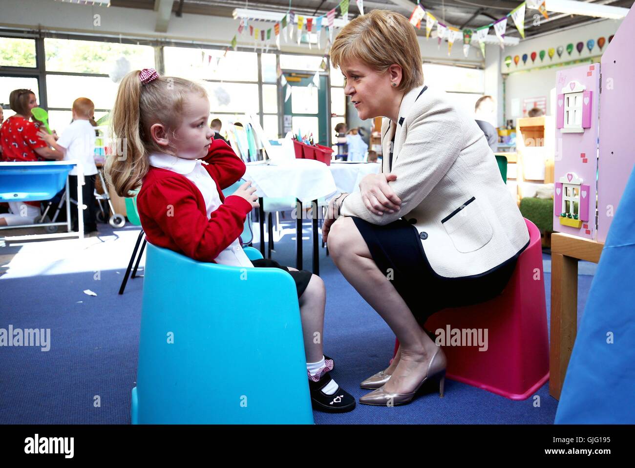 First Minister Nicola Sturgeon with P1 pupil Katie Jeffery, 4, during a visit to Burnfoot Community School, Hawick, to announce funding to raise educational attainment in deprived areas. Stock Photo