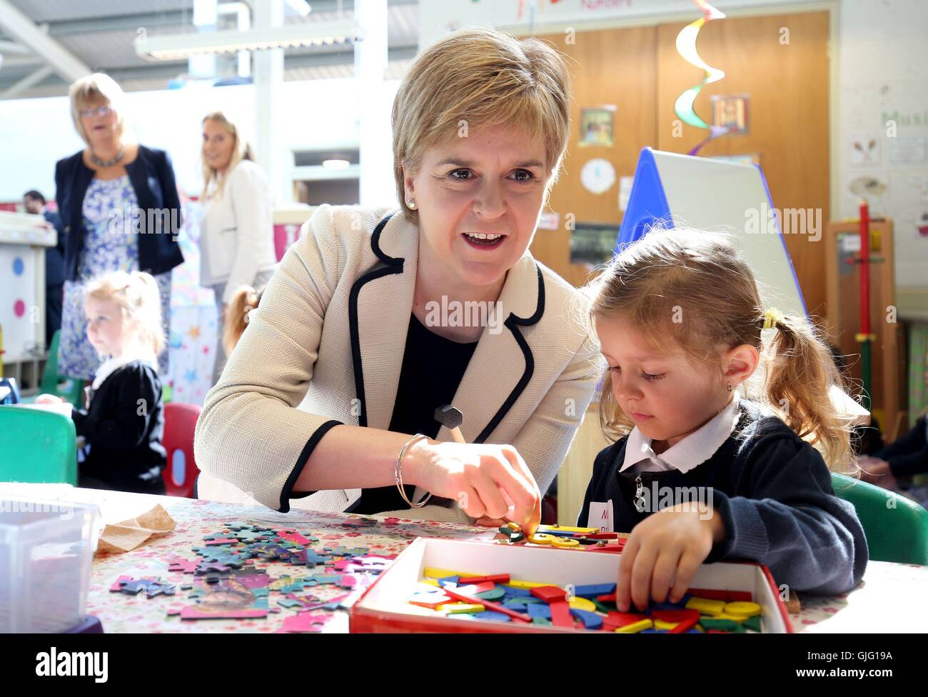 First Minister Nicola Sturgeon with P1 pupil Maja Kuzmiuk, 4, during a visit to Burnfoot Community School, Hawick, to announce funding to raise educational attainment in deprived areas. Stock Photo