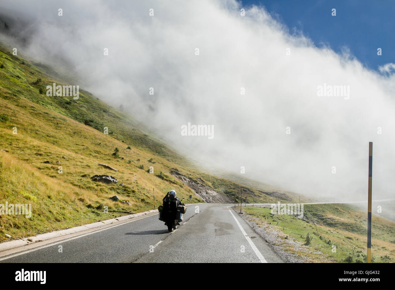 Motorbike on the road of Larra Belagua, Navarre, Spain Stock Photo