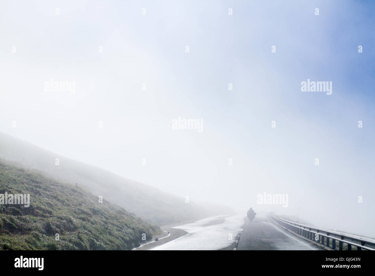 Motorbike on the road of Larra Belagua, Navarre, Spain Stock Photo