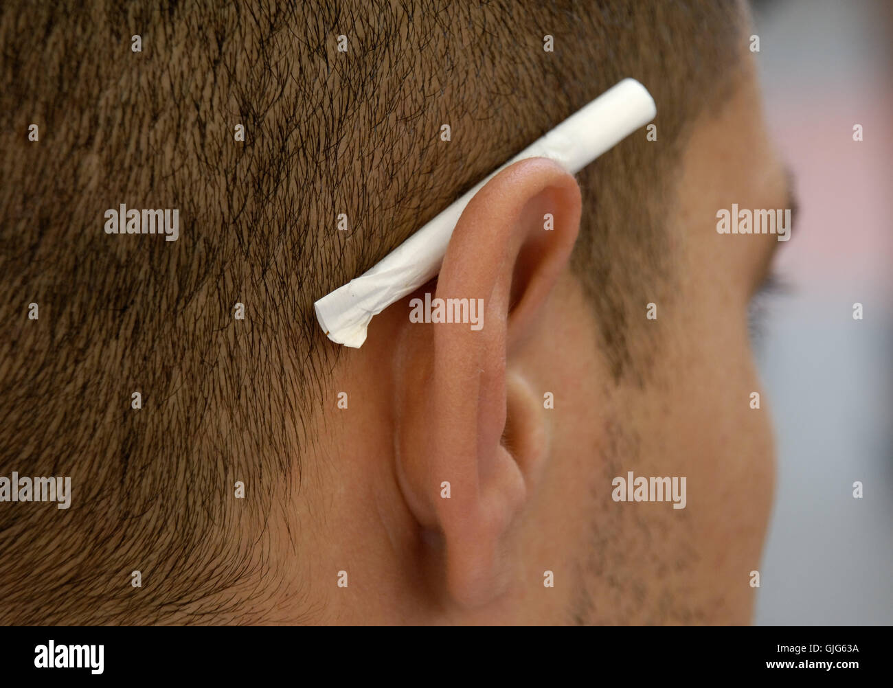 cigarette hairs macho Stock Photo