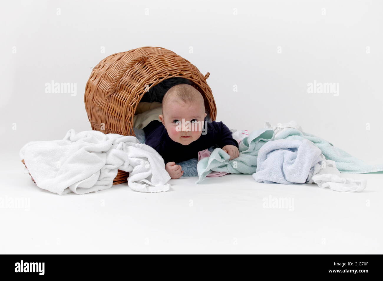 baby in laundry basket Stock Photo Alamy