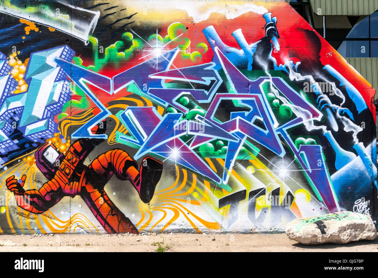 Graffiti of test tubes and a man in a protective suit, Berlin, Germany. Stock Photo
