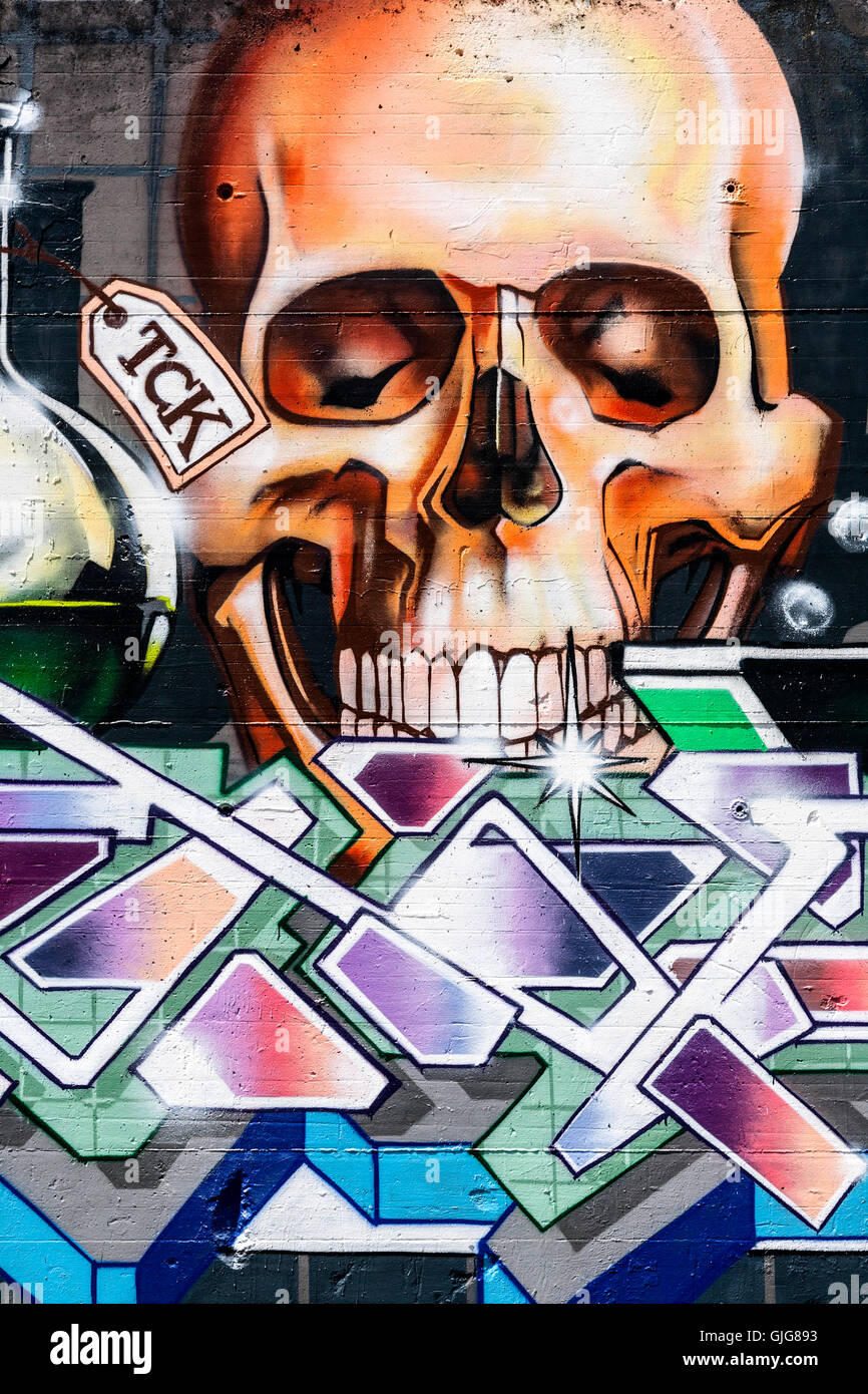 Graffiti Skull sprayed on the remnant of an old wall, Friedrichshain, Berlin, Germany. Stock Photo