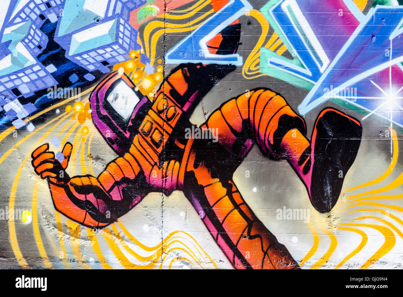Detail Graffiti image of a man in a chemical protective suit, Berlin, Germany. Stock Photo