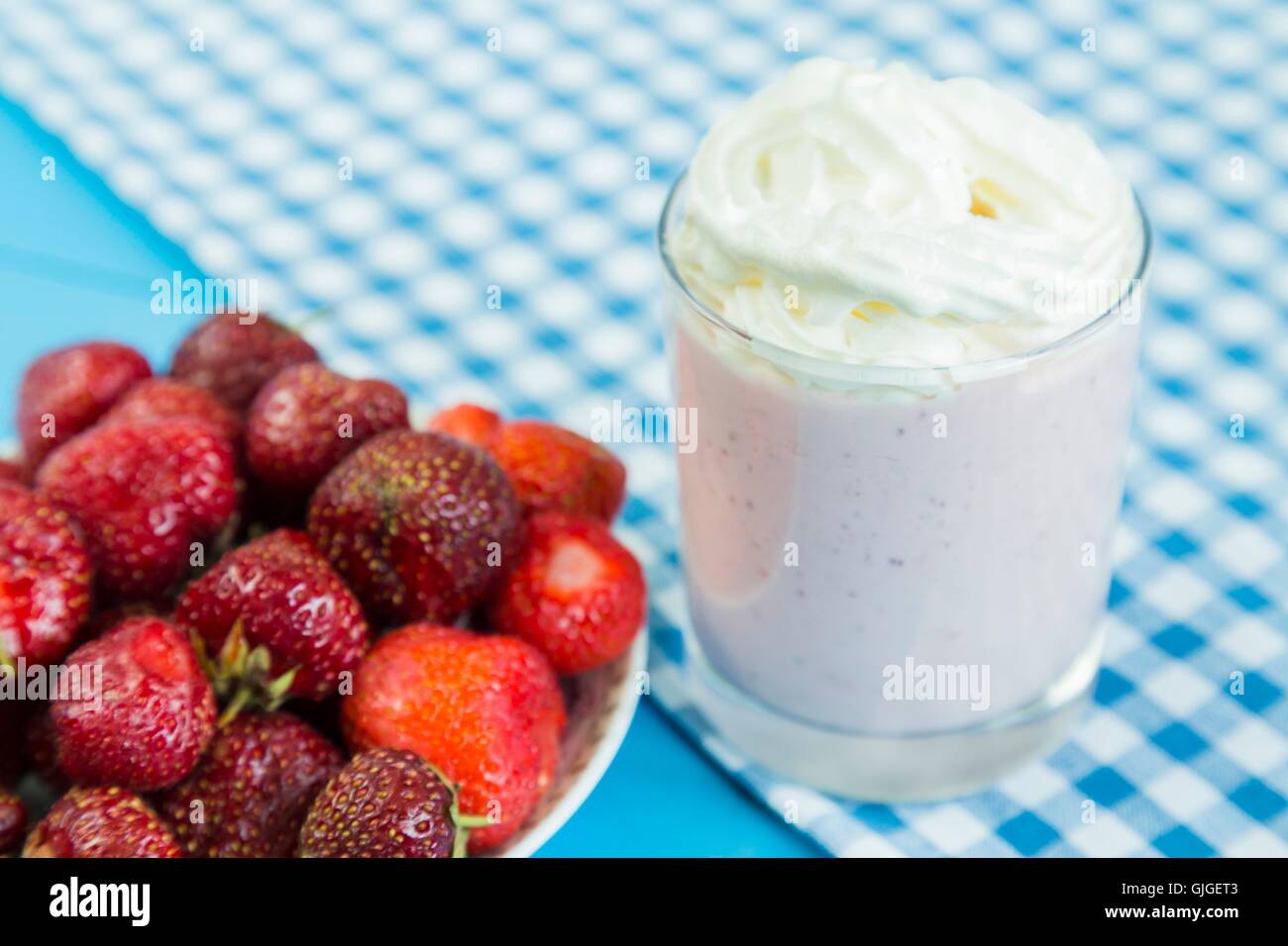 Strawberry milkshake with whipped cream Stock Photo Alamy