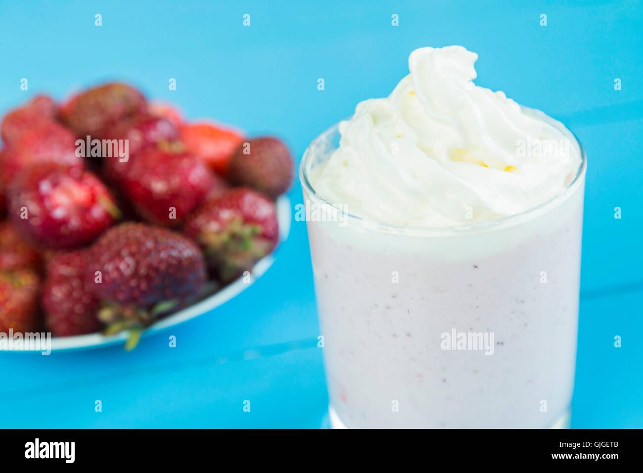 Strawberry milkshake with whipped cream Stock Photo Alamy