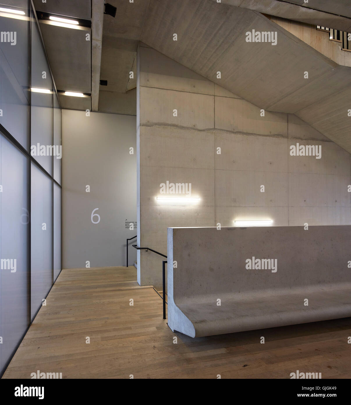 Stairwell on 6th floor with concrete bench. Switch House at Tate Modern, London, United Kingdom. Architect: Herzog and De Meuron, 2016. Stock Photo