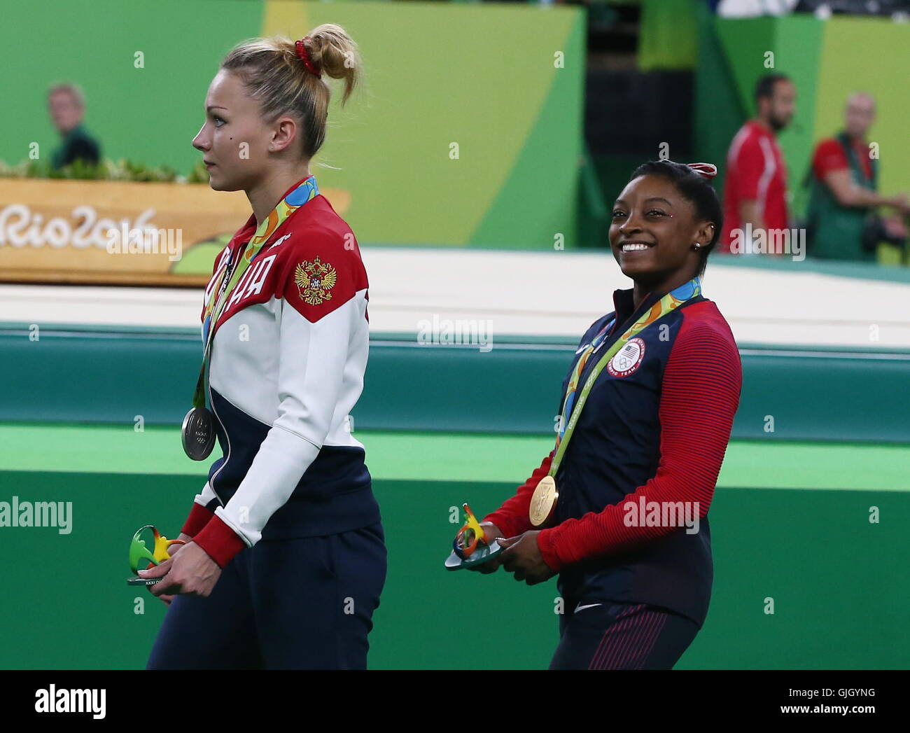 Rio De Janeiro, Brazil. 14th Aug, 2016. Silver medallist Maria Paseka of  Russia (L) and gold medal winner Simone Biles of the United States during  the medal ceremony for the women's artistic