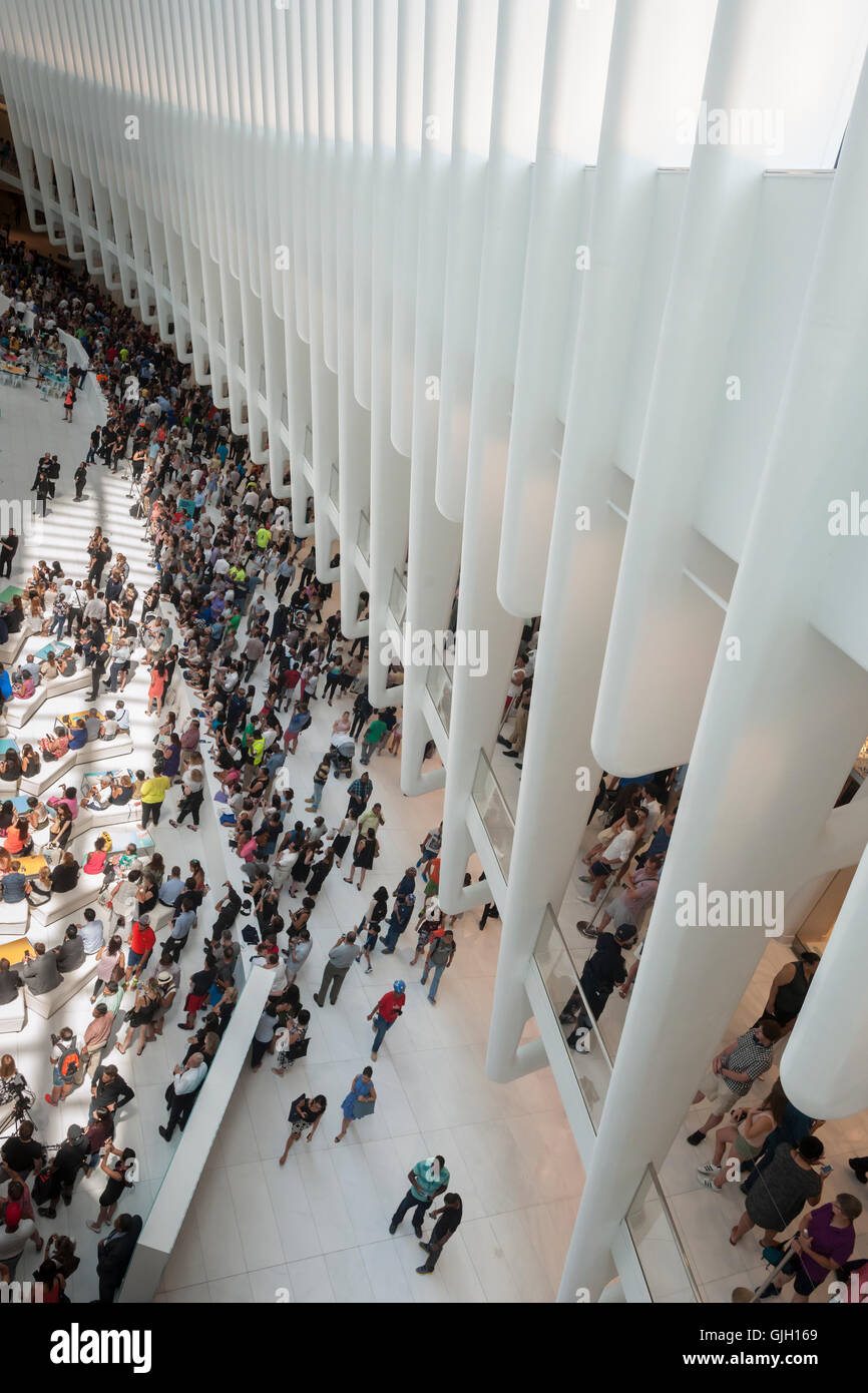 Thousands of visitors pack the World Trade Center Transportation Hub, known as the Oculus, on Tuesday, August 16, 2016 for the grand opening of the retail spaces. The 350,000 square foot retail space will feature over 100 stores when they all open, including a now opened Apple Store. The mall opens almost 15 years after the World Trade Center terrorist attack.  (© Richard B. Levine) Stock Photo