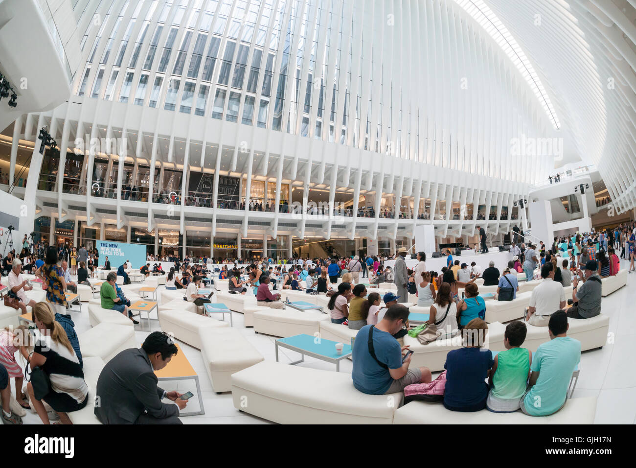 Thousands of visitors pack the World Trade Center Transportation Hub, known as the Oculus, on Tuesday, August 16, 2016 for the grand opening of the retail spaces. The 350,000 square foot retail space will feature over 100 stores when they all open, including a now opened Apple Store. The mall opens almost 15 years after the World Trade Center terrorist attack.  (© Richard B. Levine) Stock Photo