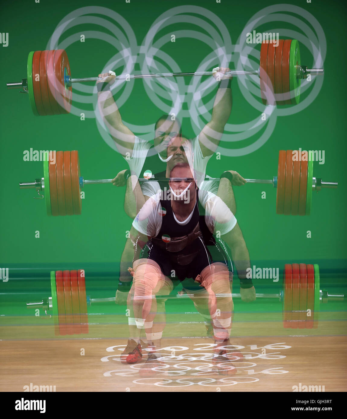 Rio de Janeiro, Brazil. 16th Aug, 2016. A multiple exposure of gold medal favorite BEHDAD SALIMI of Iran setting a world record with a 216kg snatch during the men's  105kg weightlifting final at the Rio 2016 Summer Olympic Games. He later bombed out in the clean and jerk. Credit:  Scott Mc Kiernan/ZUMA Wire/Alamy Live News Stock Photo