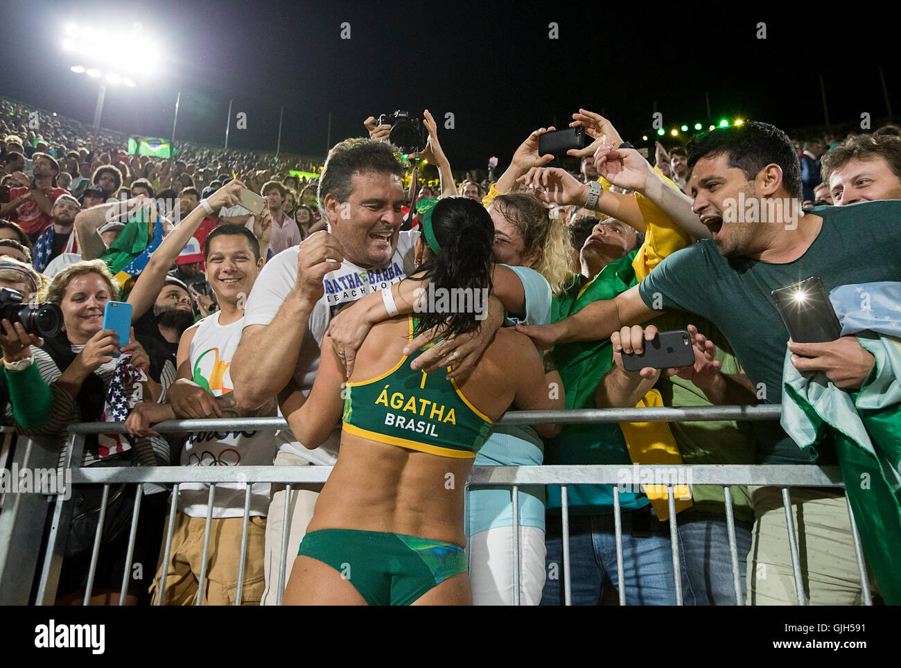 Rio de Janeiro, RJ, Brazil. 17th Aug, 2016. OLYMPICS BEACH VOLLEYBALL :Agatha Rippel Bednarczuk (BRA) celebrates with supporters after beating Kerri Walsh Jennings (USA) and April Ross (USA) in the semifinals at Beach Volleyball Arena during the 2016 Rio Summer Olympics games. Credit:  Paul Kitagaki Jr./ZUMA Wire/Alamy Live News Stock Photo