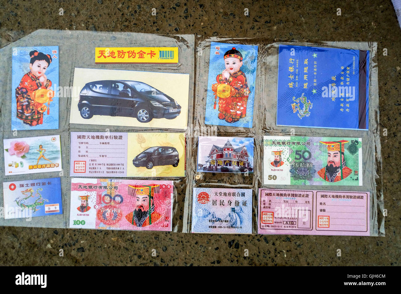 Anyang, Anyang, China. 17th Aug, 2016. Anyang, CHINA-?August 16?2016:?(EDITORIAL?USE?ONLY.?CHINA?OUT) Various weird offerings including fake iPhones, villas, false paper money and cigarettes are on sale in Hua County, central ChinaÂ¡Â¯s Henan Province, before the traditional Zhongyuan Festival comes. Chinese traditional Zhongyuan Festival, also known as Ghost Festival, is celebrated on 15th day of the seventh lunar month. People usually burn incense and paper money as an offering to the spirits of deceased ancestors during the festival. © SIPA Asia/ZUMA Wire/Alamy Live News Stock Photo