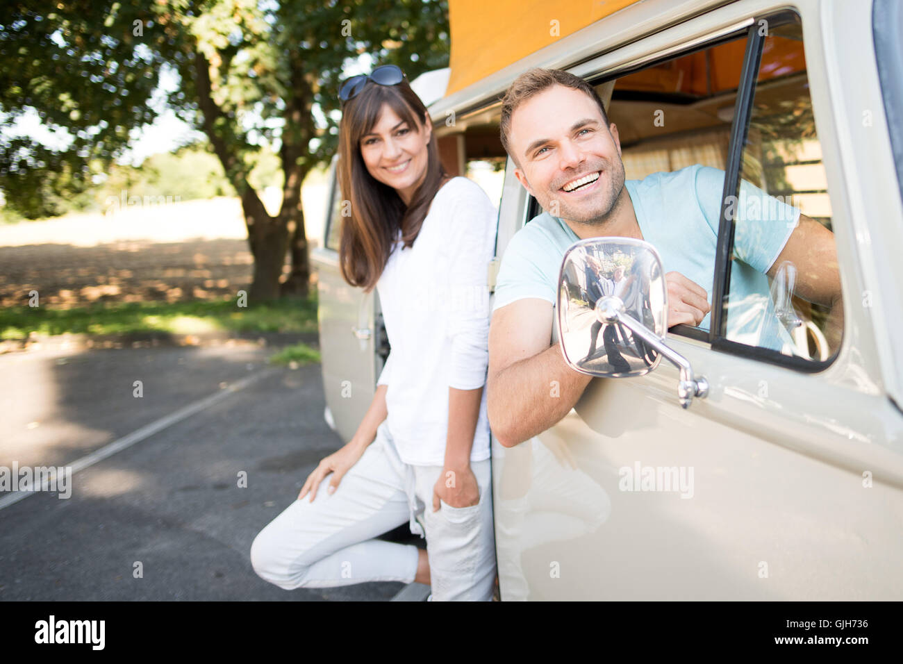 Duesseldorf, Germany. 17th Aug, 2016. Models Dunja and Stefan posing in front of a Volkswagen T2a Westfalia during a press conference prior to the Camping Fair 'Caravan Salon' in Duesseldorf, Germany, 17 August 2016. According to the organisor, it's the world's largest fair for motor homes and caravans. This year its runs from 27 August to 4 September and this year celebrates its 55th anniversary. Photo: MARUIS BECKER/dpa/Alamy Live News Stock Photo