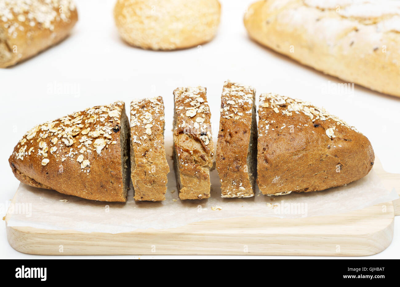 Sliced french oat wheat bread isolated on white background Stock Photo ...