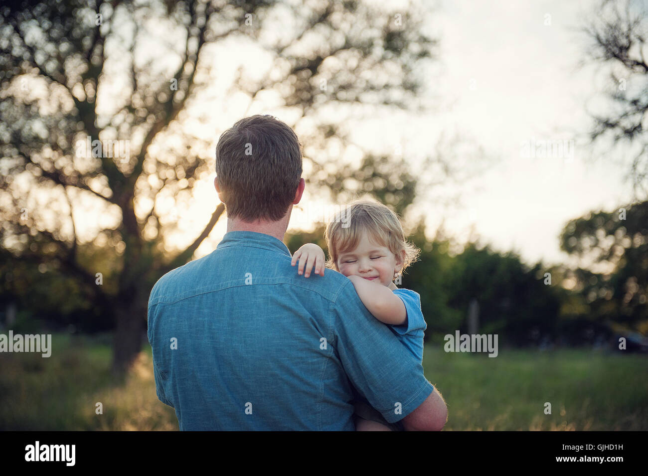 Father carrying his son hi-res stock photography and images - Alamy