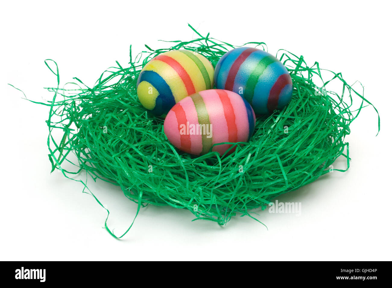three easter eggs in nest Stock Photo - Alamy