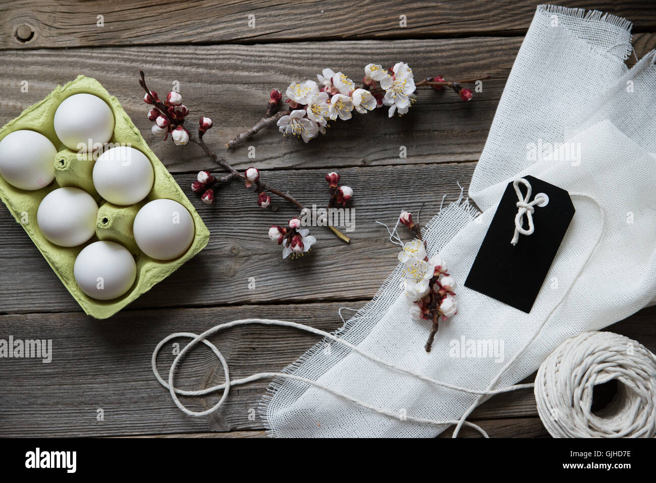 Eggs, cherry blossom, muslin, string and label Stock Photo