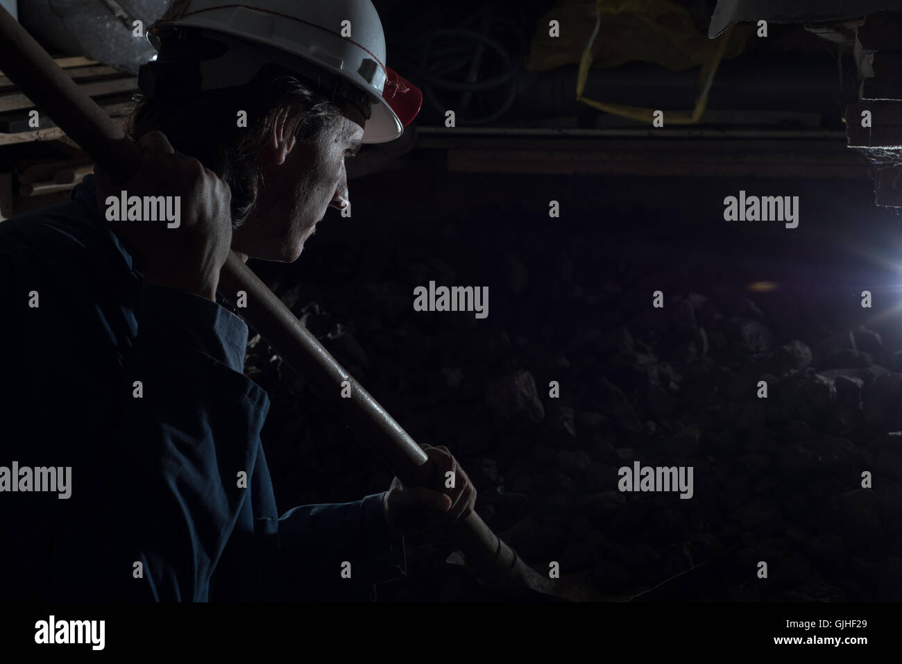 Miner in Coal mine with shovel Stock Photo Alamy