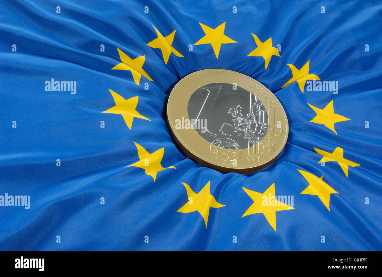 euro coin on the european flag Stock Photo