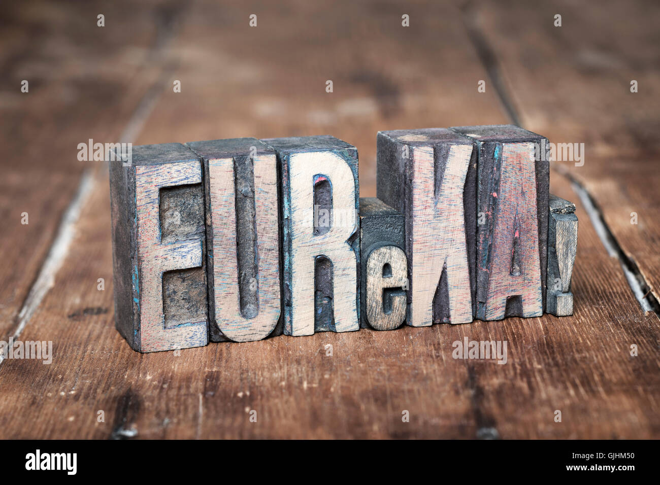 eureka exclamation made from wooden letterpress type on grunge wood Stock Photo