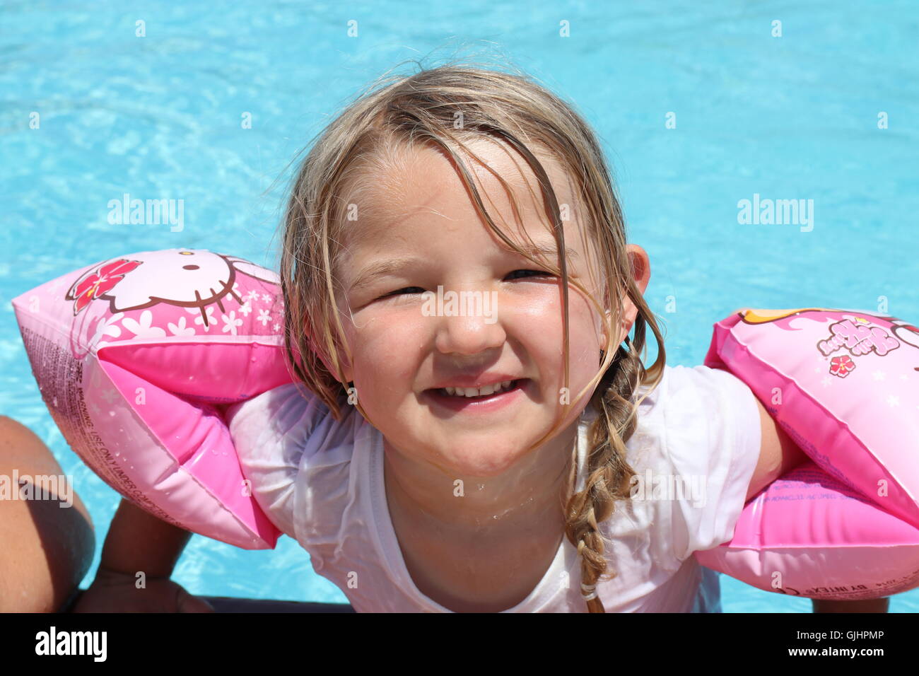 Children armbands in swimming pool hires stock photography and images
