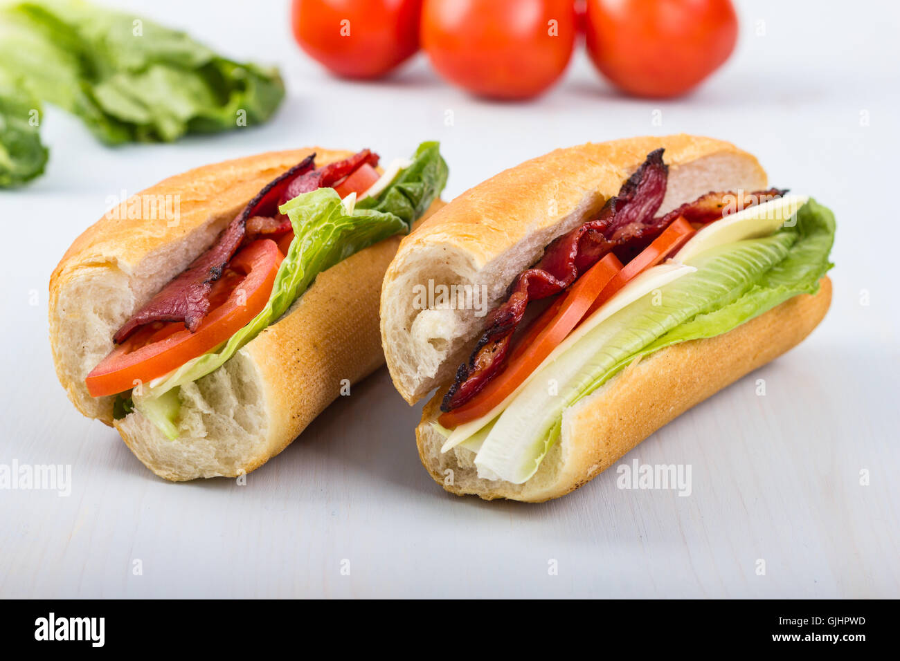 Fresh sandwich with tomatoes, bacon, and lettuce. Stock Photo