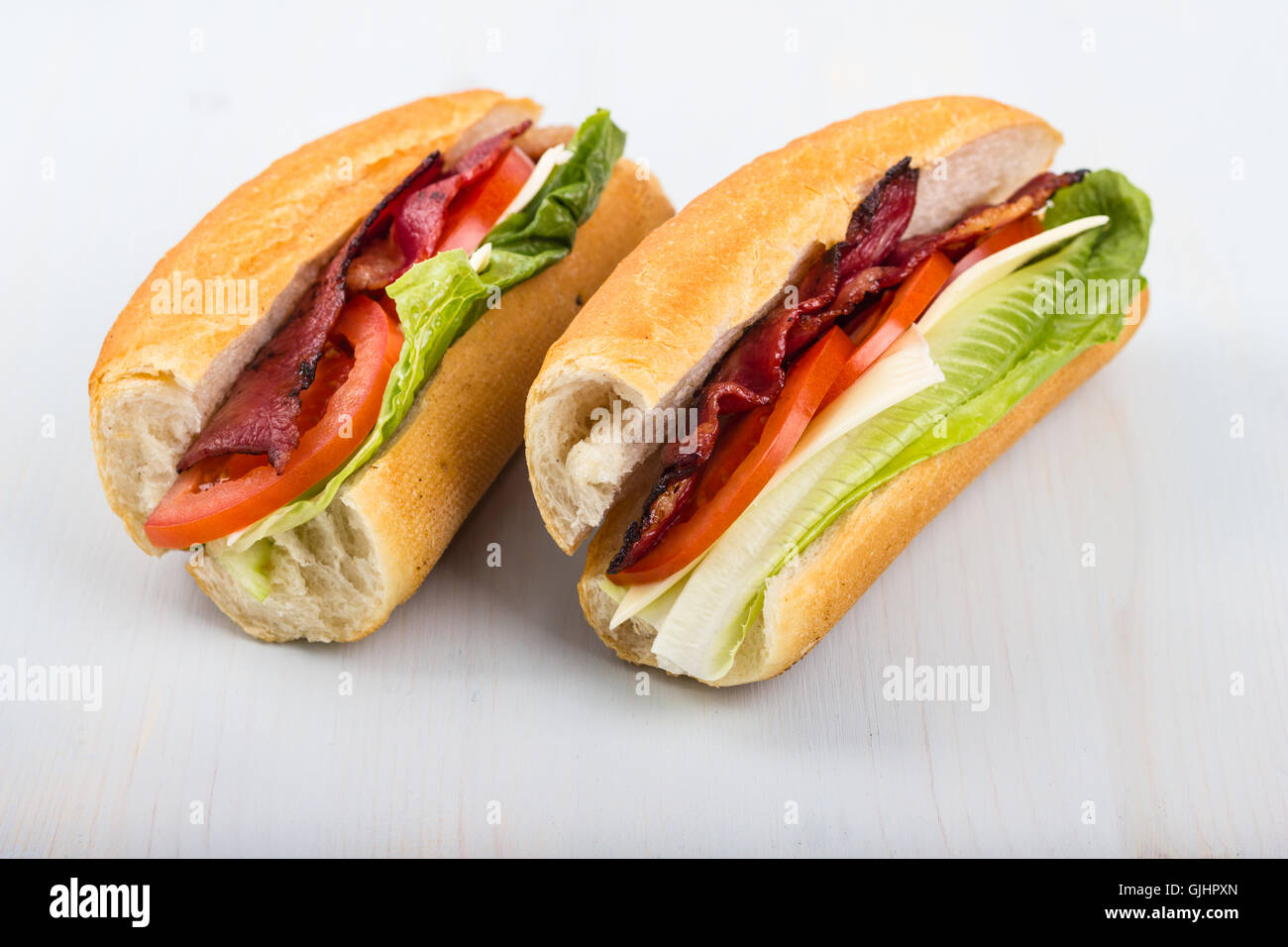 Fresh sandwich with tomatoes, bacon, and lettuce. Stock Photo