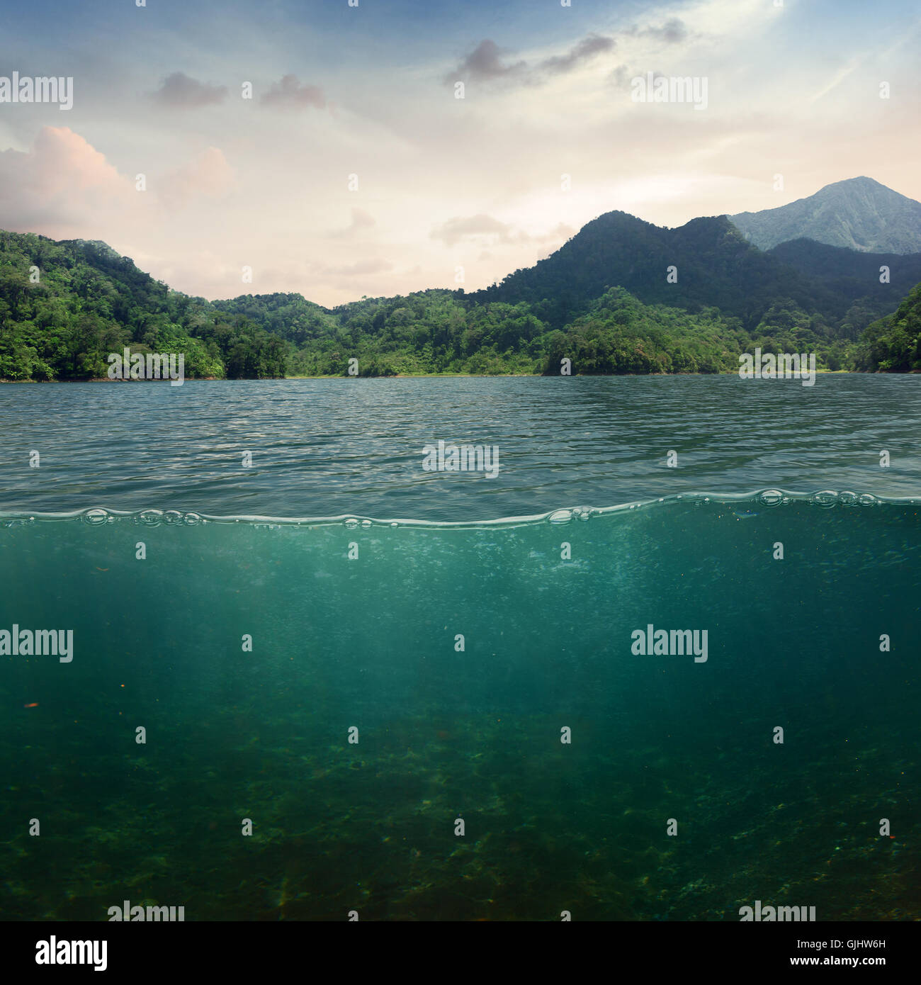 Sea landscape design template with underwater part and coast mountain splitted by waterline Stock Photo