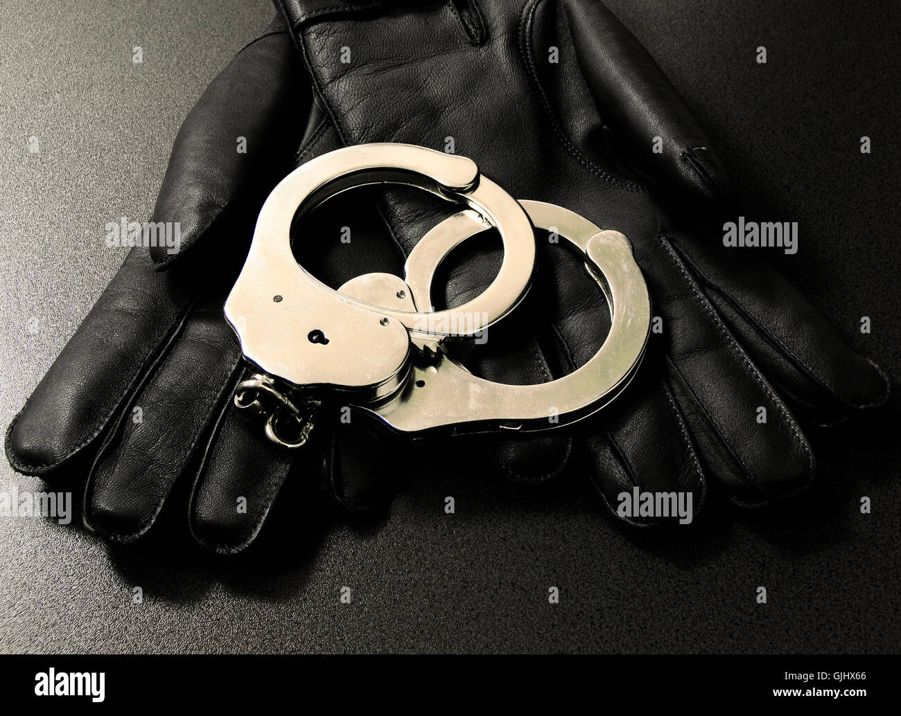 gloves manacle handcuffs Stock Photo Alamy
