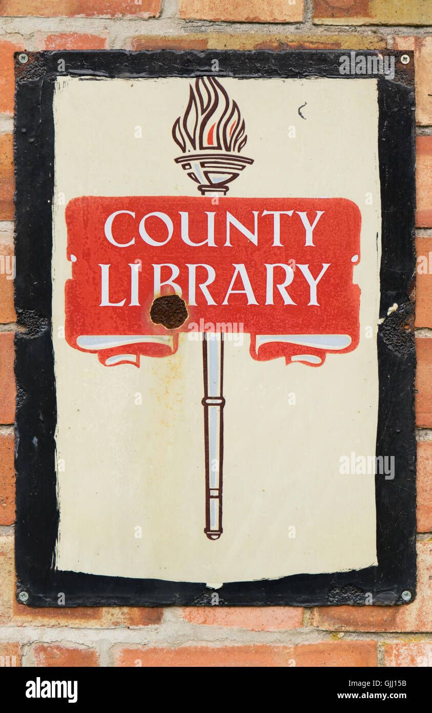 Old 1950s UK metal county library sign on a brick wall Stock Photo - Alamy
