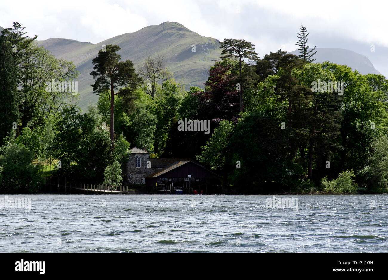 House with a boathouse on an island in the middle of the lake Derwent