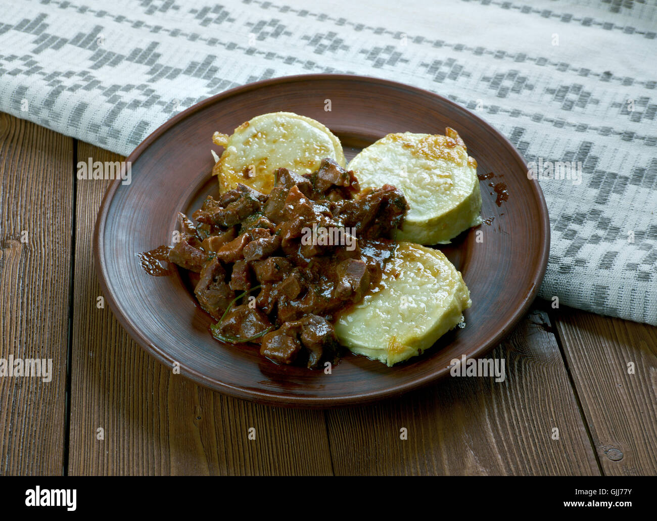 Goulash from  beef heart with fried zucchini. Hungarian cuisine Stock Photo