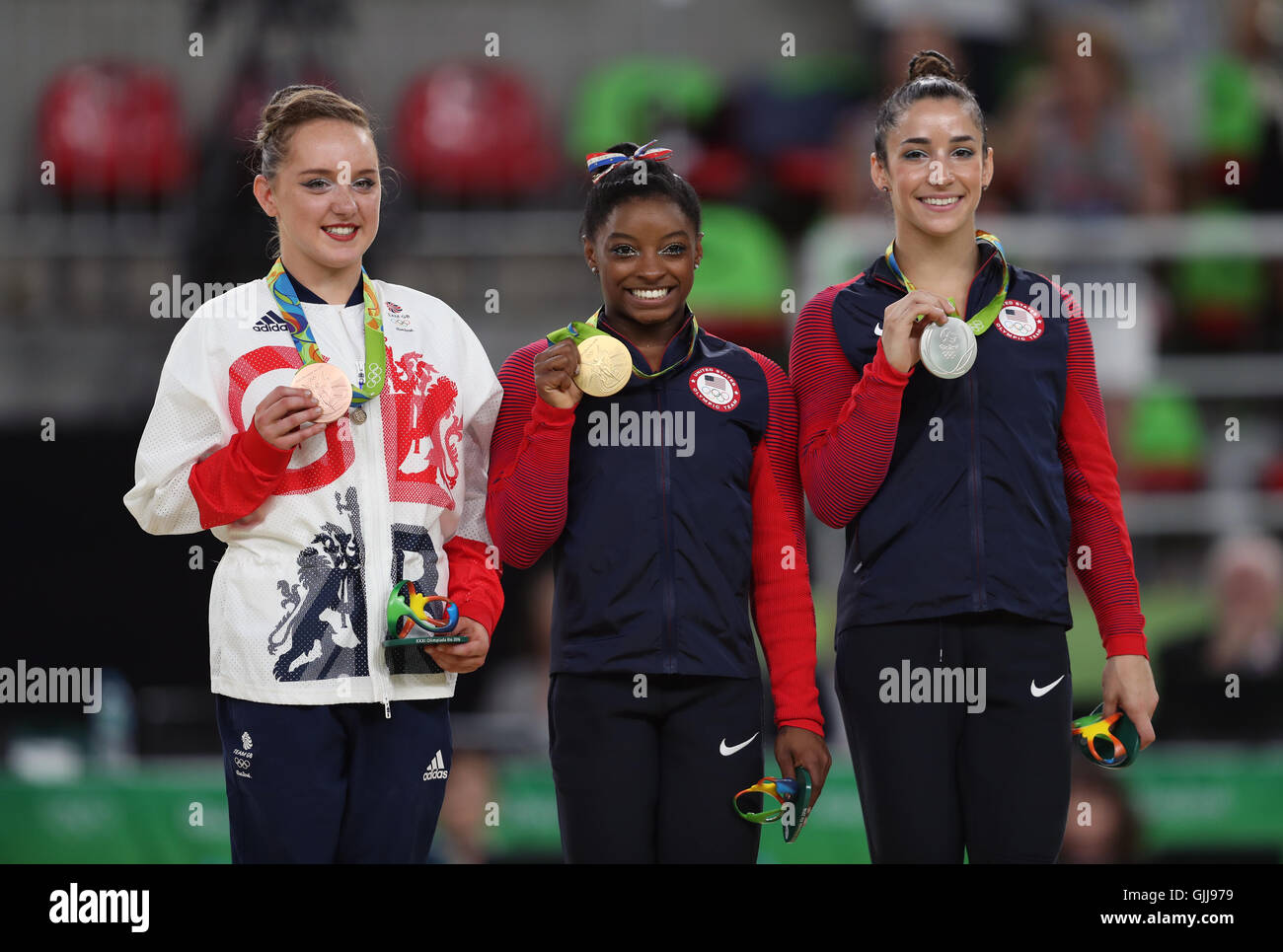 Great Britain's Amy Tinkler celebrates a bronze meda with Gold medalist Simone Biles and silver medalist Aly Raisman (right)l in the Women's Floor Exercise final at the Rio Olympic Arena on the eleventh day of the Rio Olympics Games, Brazil. Stock Photo