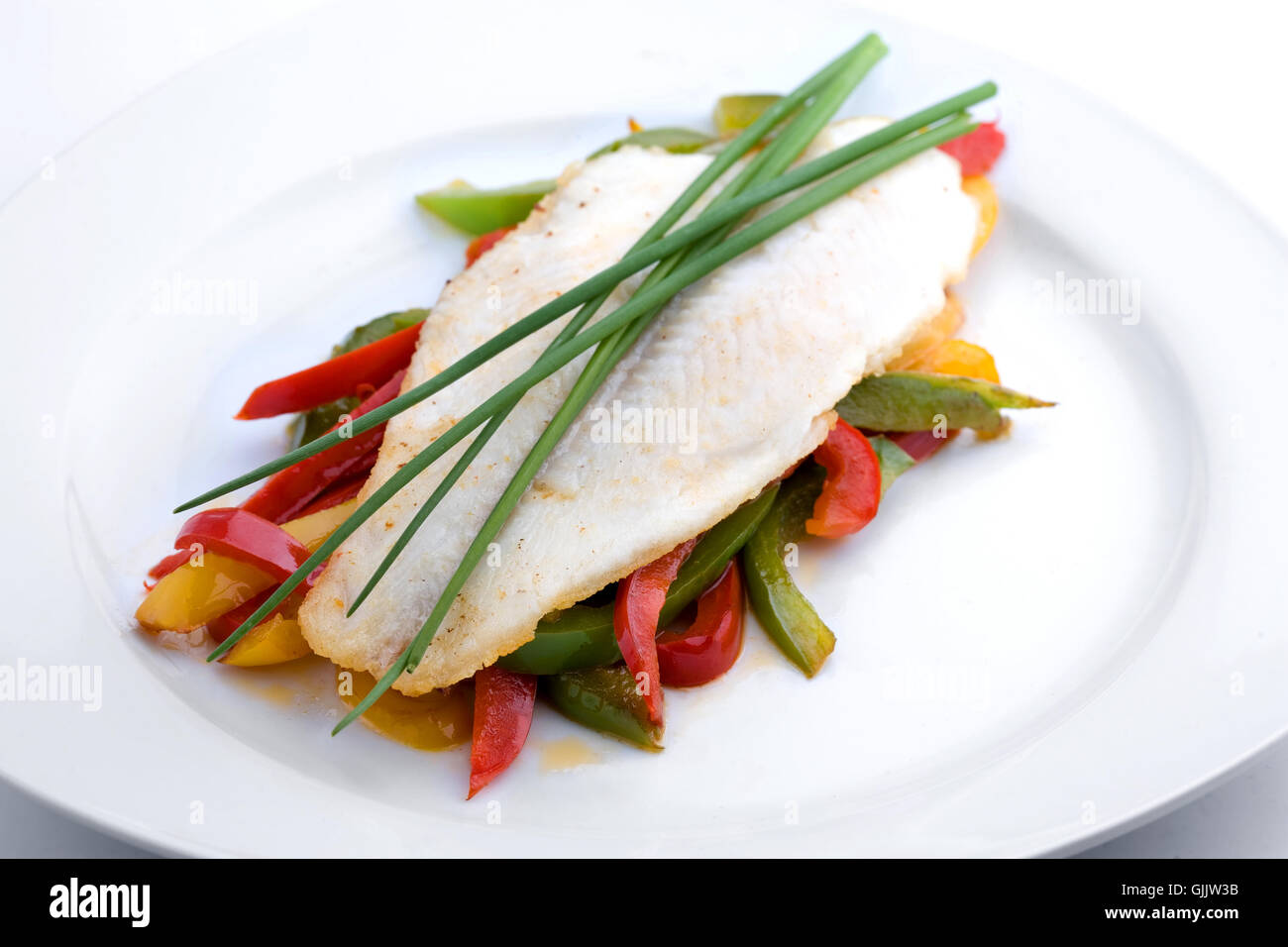 pangasius fillet on peppers Stock Photo