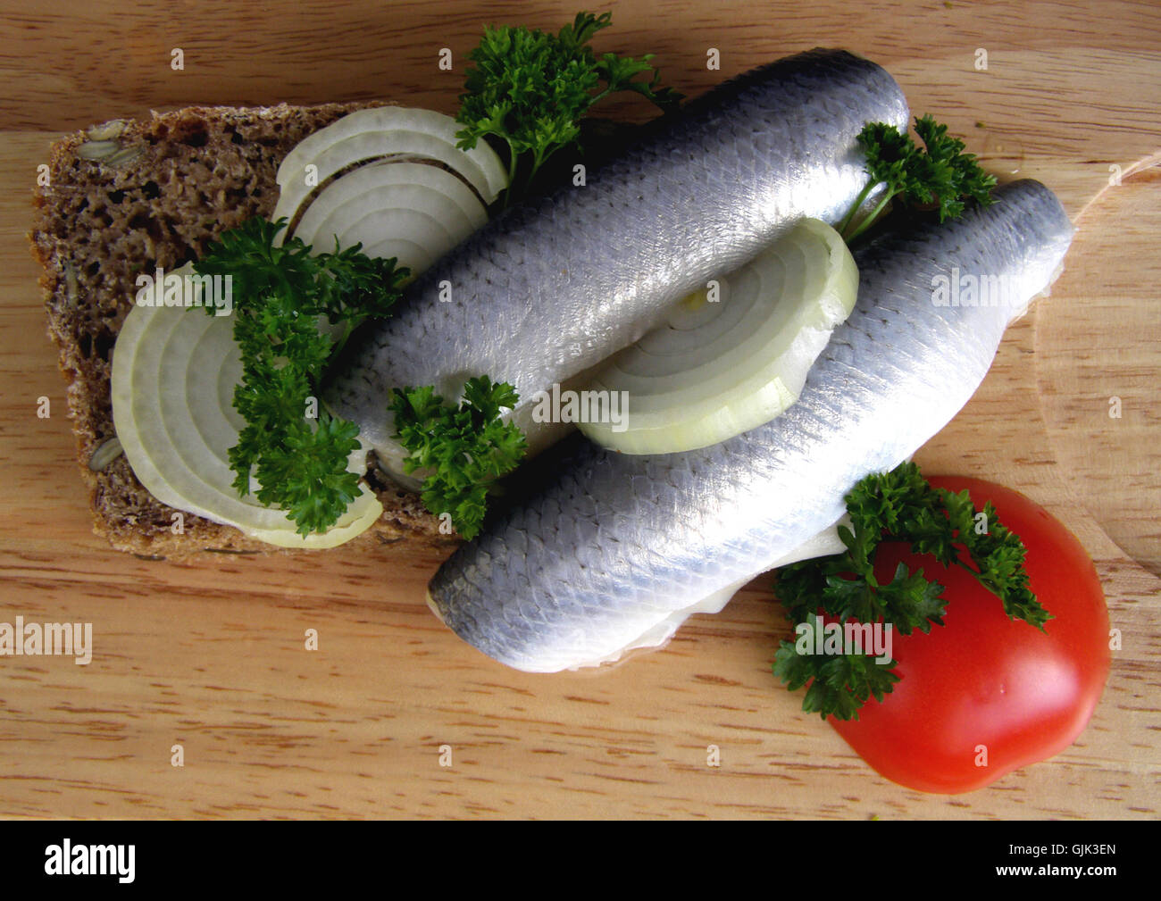 herring between meal food Stock Photo Alamy