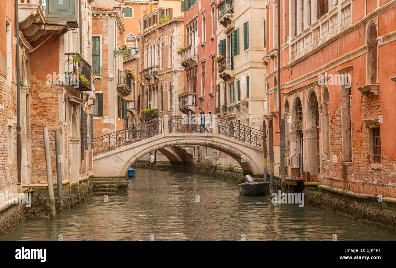 Venice canal with buildings and bridge Stock Photo