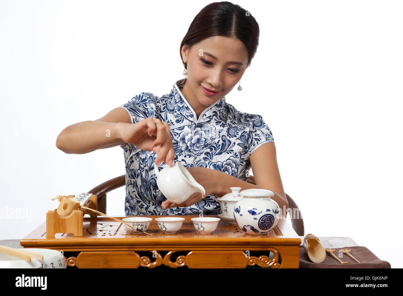 Dressed in traditional Chinese costumes studio shot young woman show ...