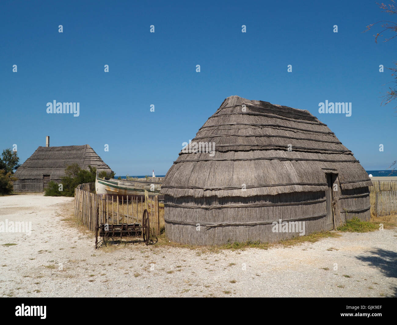 Replica traditional reed huts in a museum fishing village in le ...