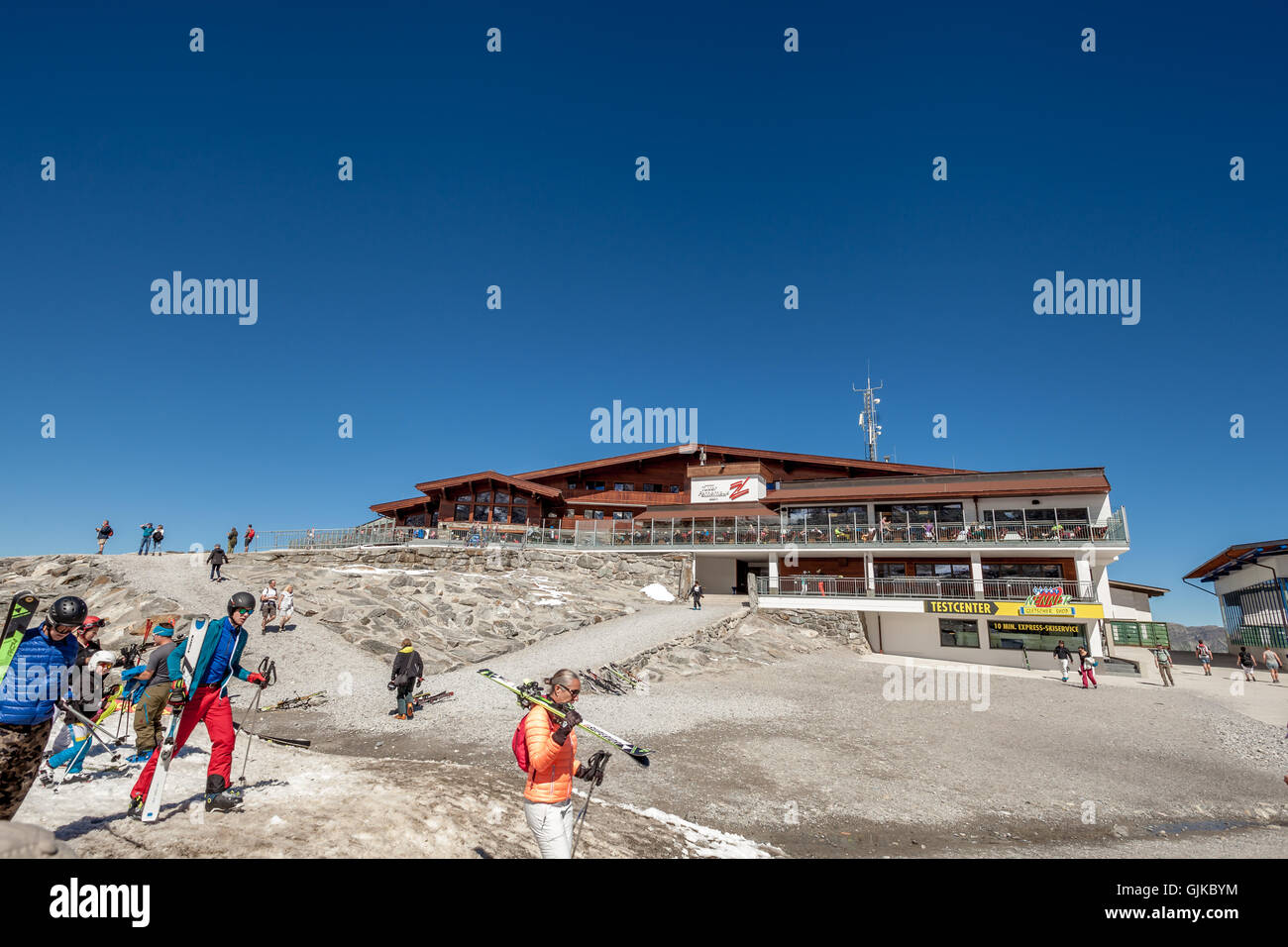 skiers on ski track near cableway lift station Gletscherbus in Zillertal, Austria Stock Photo