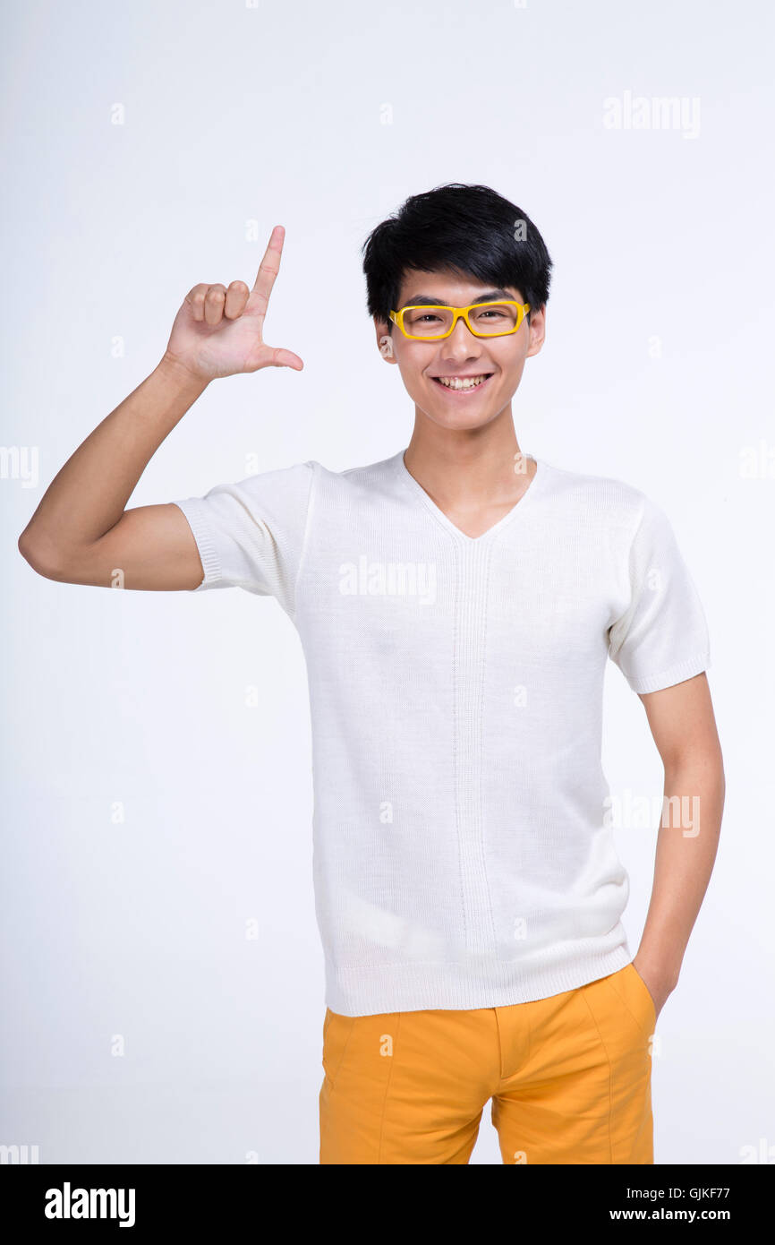 Studio shot of young man Stock Photo - Alamy