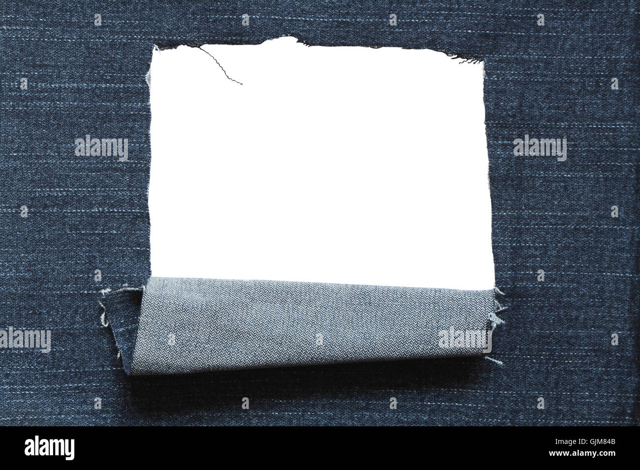 Hole In Jeans Textured Stock Photo